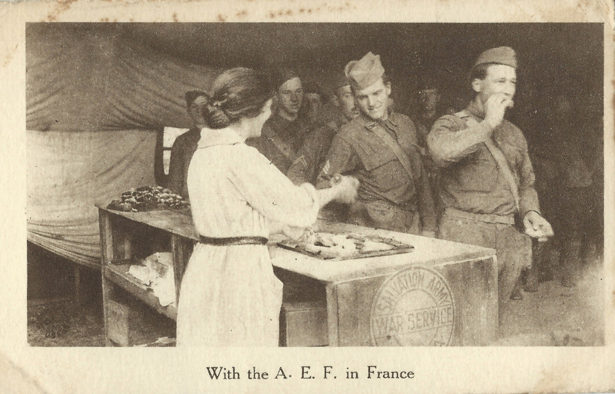 Salvation Army officers giving dougnuts to soldiers